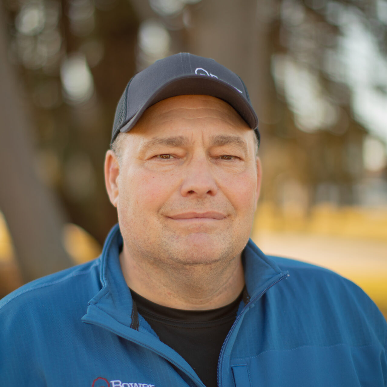 Craig Martins standing outside with a blurred background.